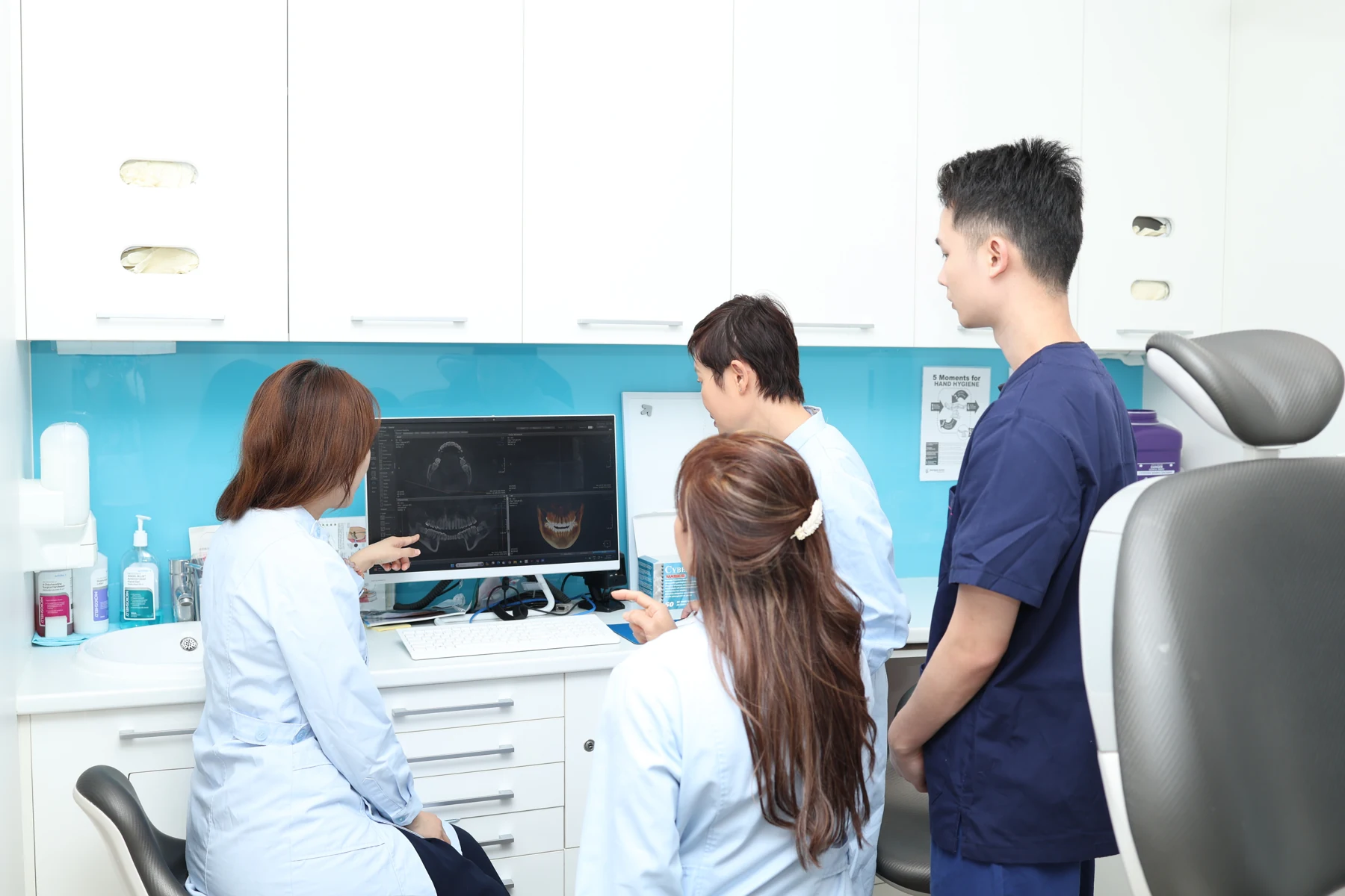 uSmile clinicians discussing a dental scan in the practice
